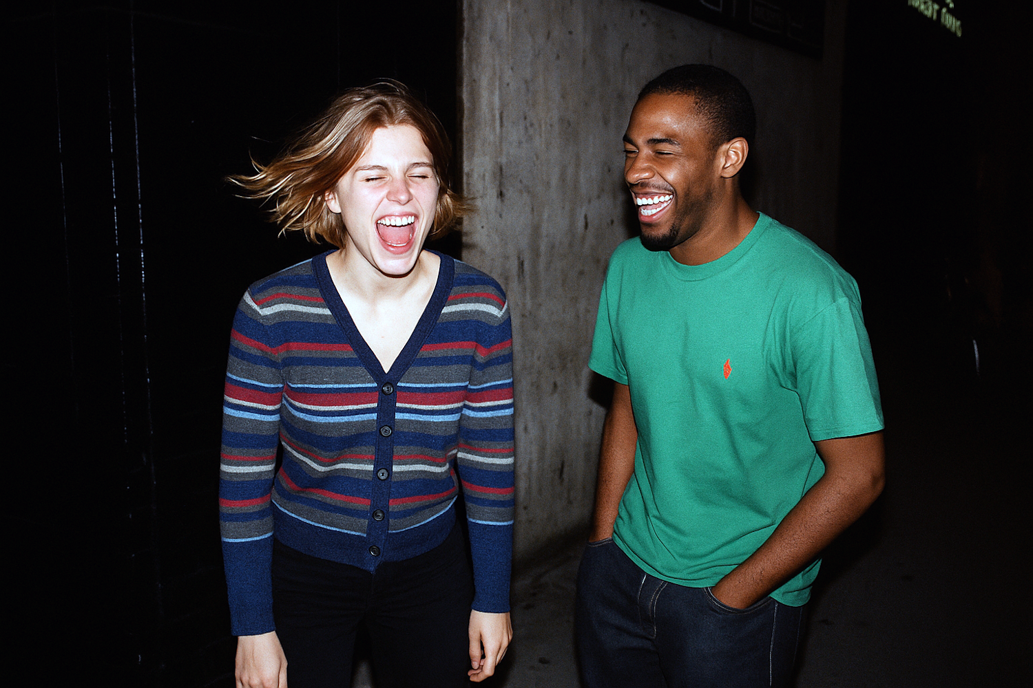 Two people sharing a laugh, embodying the shared experience and freedom of a multi-person time loop.