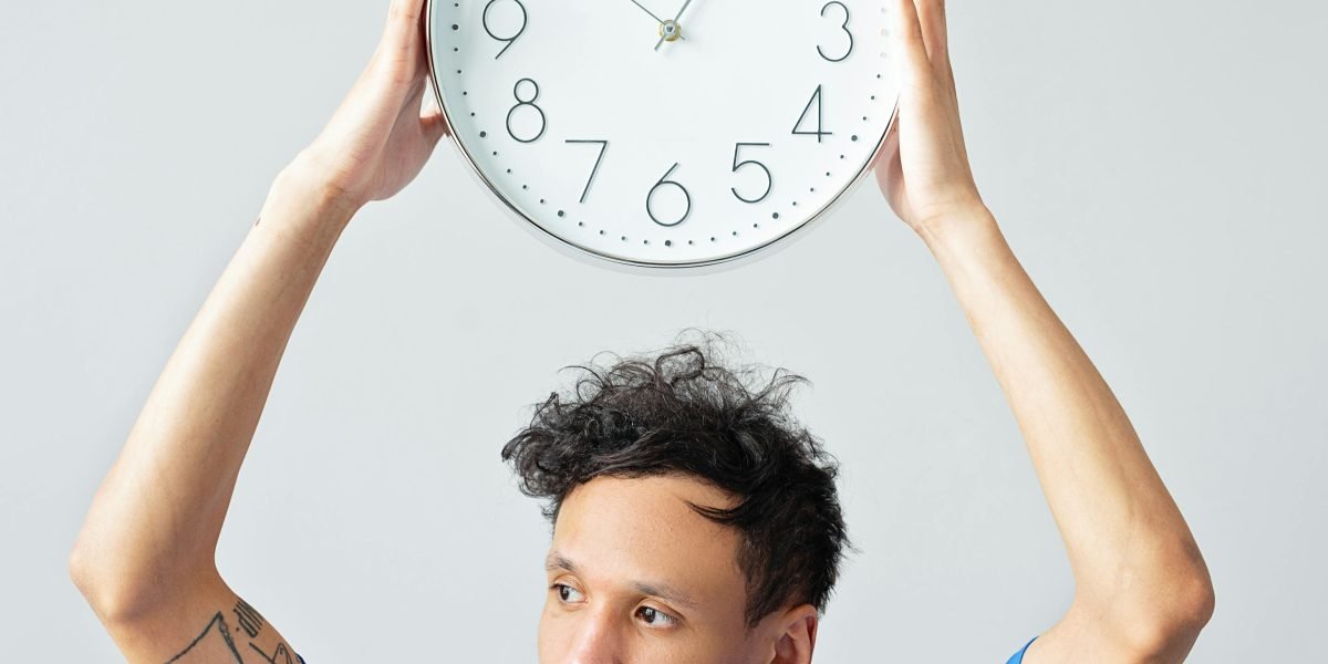 A person under pressure, checking a clock or looking urgently, symbolizing the countdown element in disaster films.