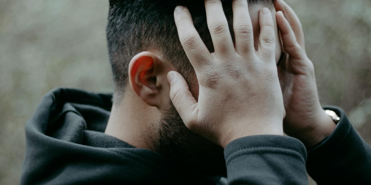 A person looking frustrated while browsing entertainment options, reflecting discovery fatigue.