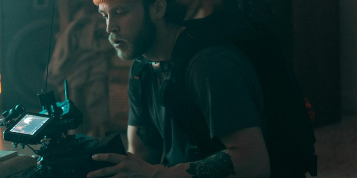 A filmmaker deep in thought, seeking inspiration and envisioning new narratives, reflecting Lynch's lasting influence on other creators.